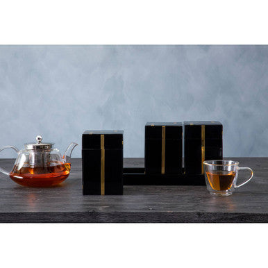 Black rectangular tea boxes with gold vertical stripes in odell black glossy resin gold set of 3 jars with tray