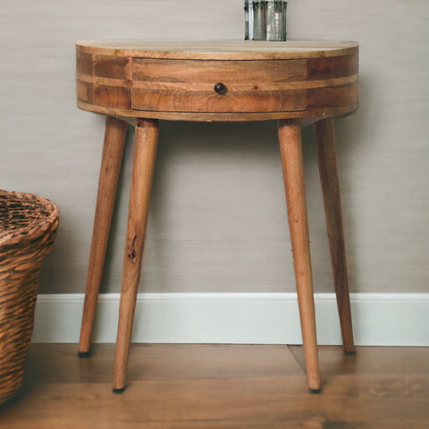 Odyssey oak-ish console table with rustic round wooden top, single drawer with dark knob, and tapered legs