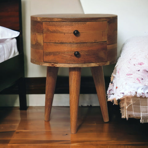 Rustic odyssey oak-ish tripod bedside table with warm brown mango wood finish and two drawers on tapered legs