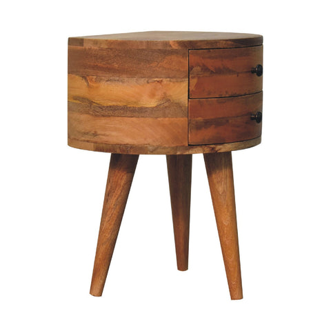 Rustic odyssey oak-ish tripod bedside table with round top, two drawers with black knobs, tapered mango wood legs