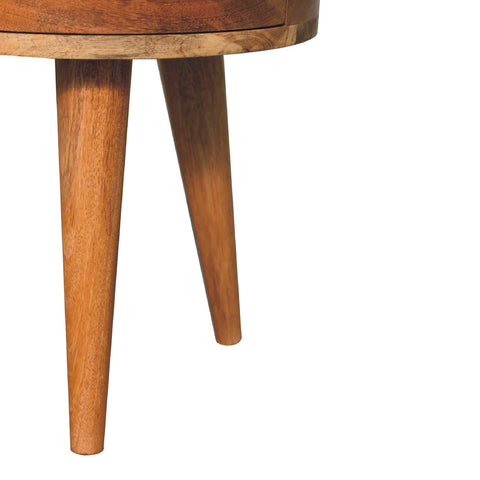 Odyssey oak-ish tripod bedside table in warm mango wood with tapered legs and smooth natural finish
