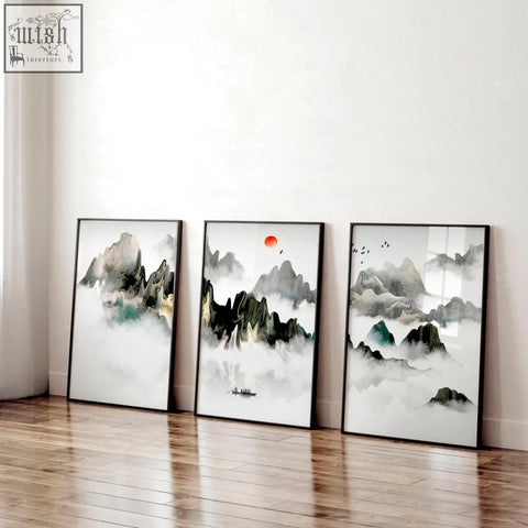 Three framed ink wash wall art prints with misty gray and green mountains and a red sun perfect for office decor ideas