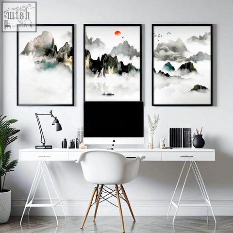 White minimalist desk with sleek metal legs and multiple drawers paired with wall art prints for office decor ideas