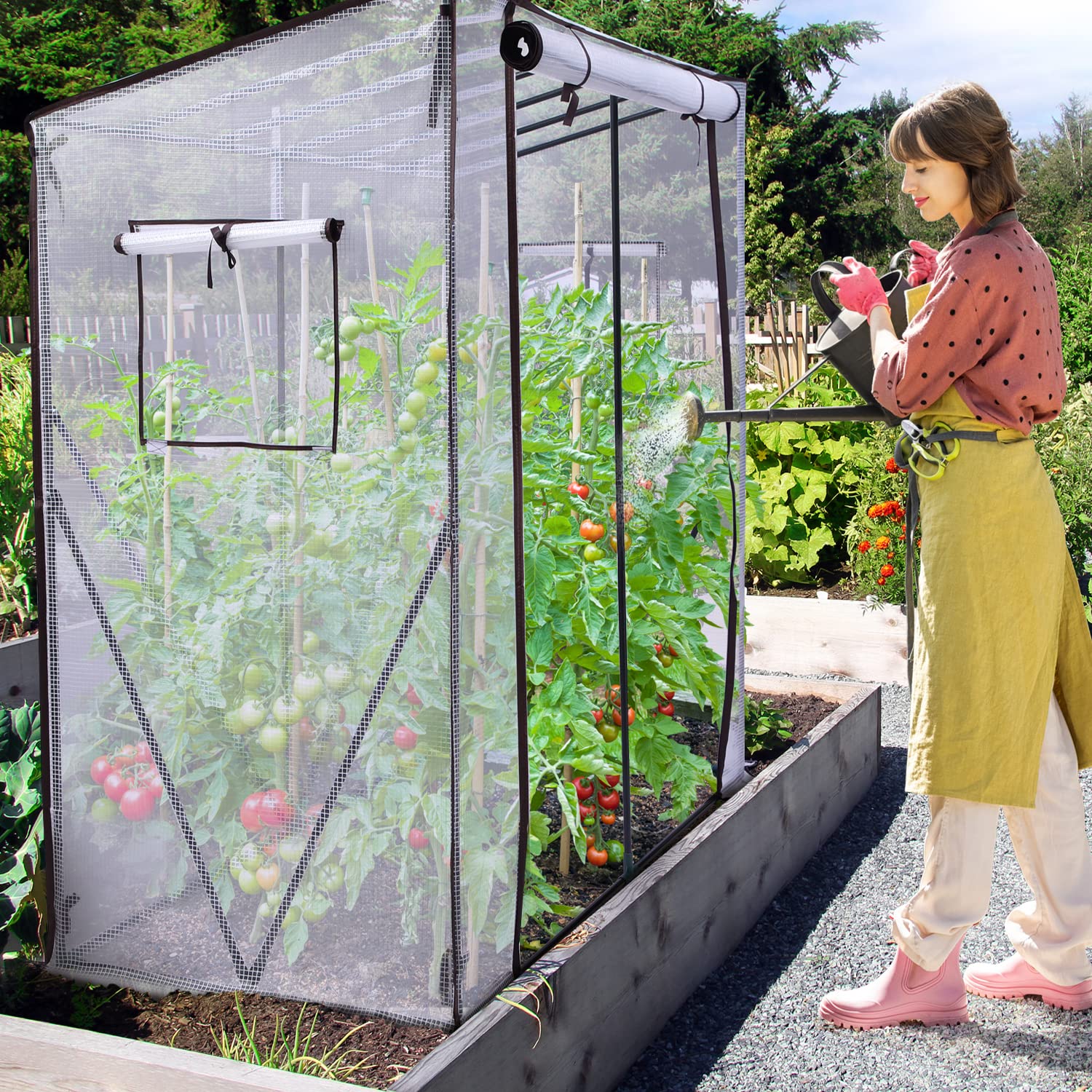 Ohuhu tomato greenhouse with transparent mesh, black trim, roll-up zippered door, and thriving tomato plants inside