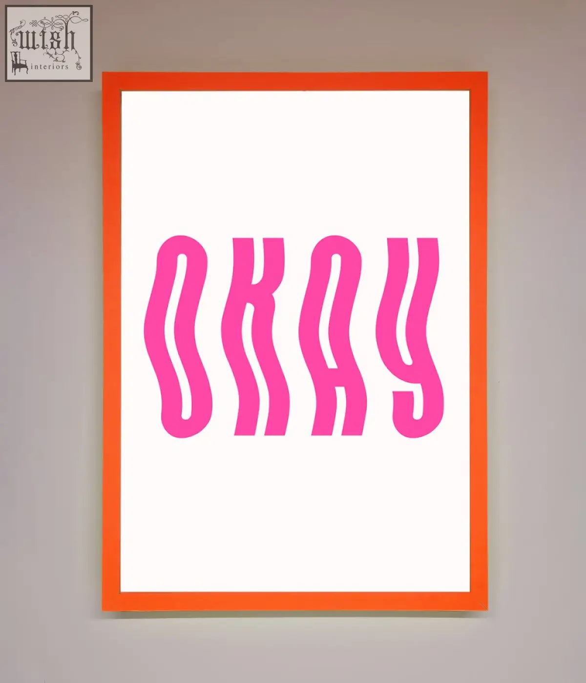 Okay framed poster with bold wavy pink lettering on a white background and a vibrant orange frame