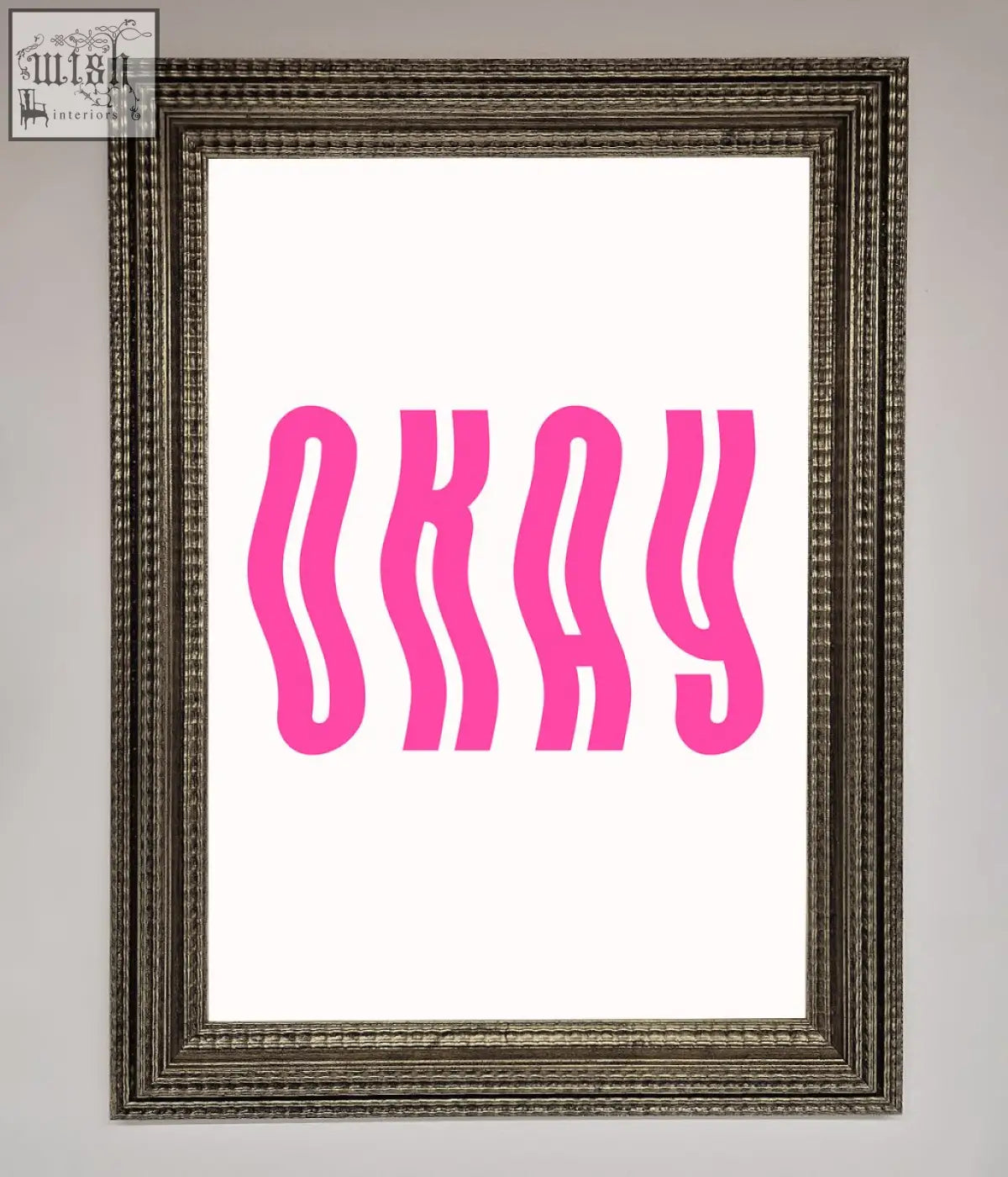 A framed poster featuring the word okay in bold wavy pink letters on a white background for wall decor