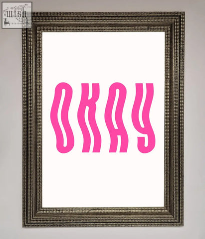 A framed poster featuring the word okay in bold wavy pink letters on a white background for wall decor