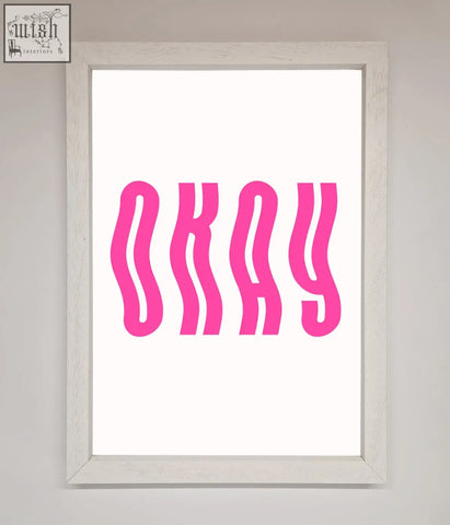 A framed poster with bold wavy pink okay lettering on a white background perfect for casual wall art
