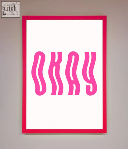 A vibrant pink framed poster with bold wavy magenta okay lettering on a clean white background perfect for decor