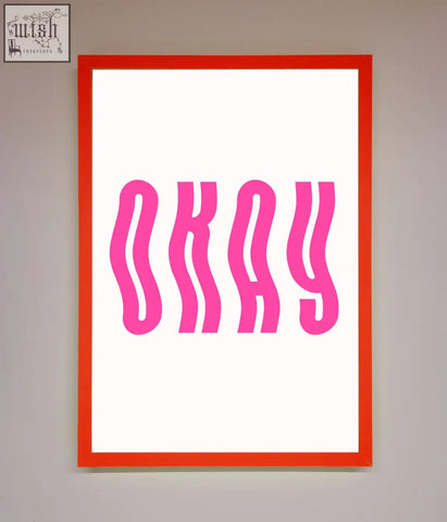 A vibrant red-framed poster with bold wavy pink okay lettering on white background perfect framed poster decor