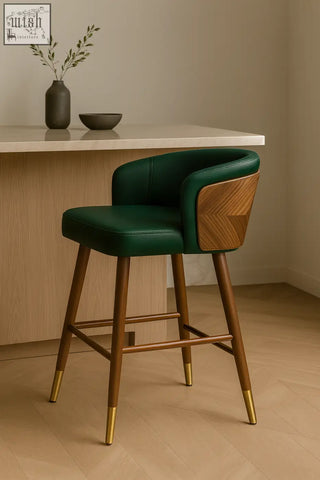 Emerald green leather okazaki bar stool with wooden back panel and gold tipped legs for stylish seating