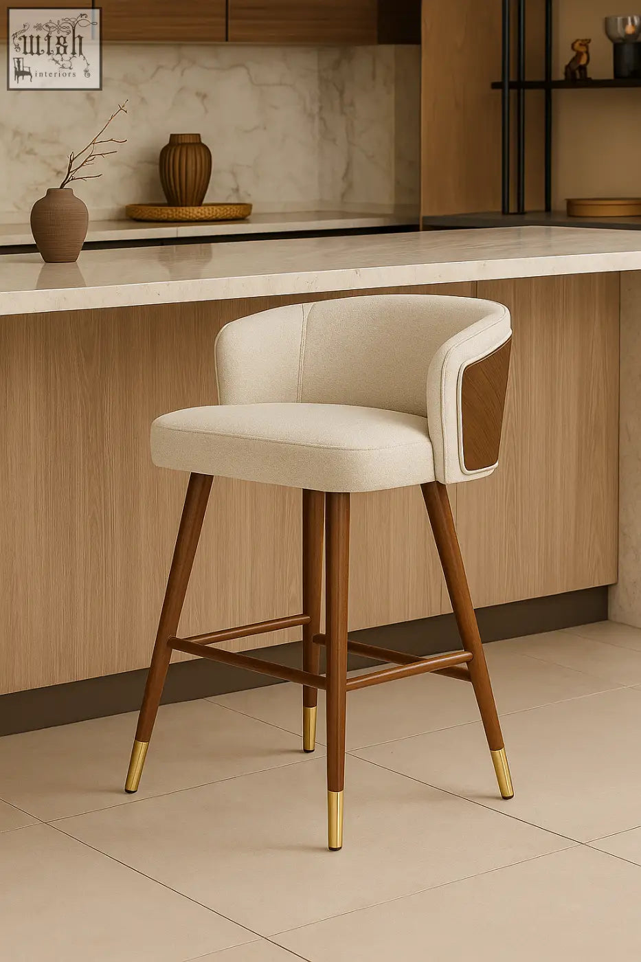 Cream-colored upholstered okazaki bar stool with wooden legs and gold-tone metal caps for stylish seating