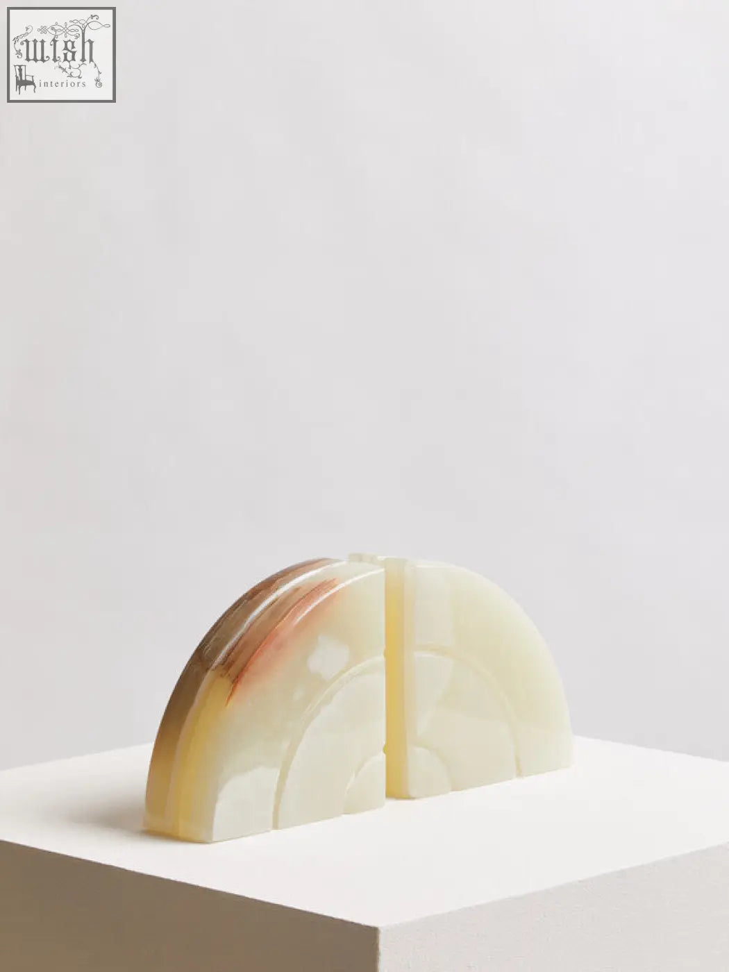 Creamy two onyx bookends with smooth polished surface and amber to white gradient veining from the oleena set