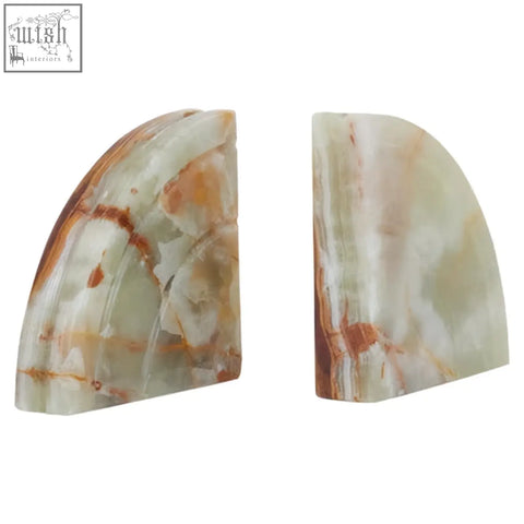 A pair of elegant oleena set two onyx bookends in soft green and warm amber with a natural marbled pattern