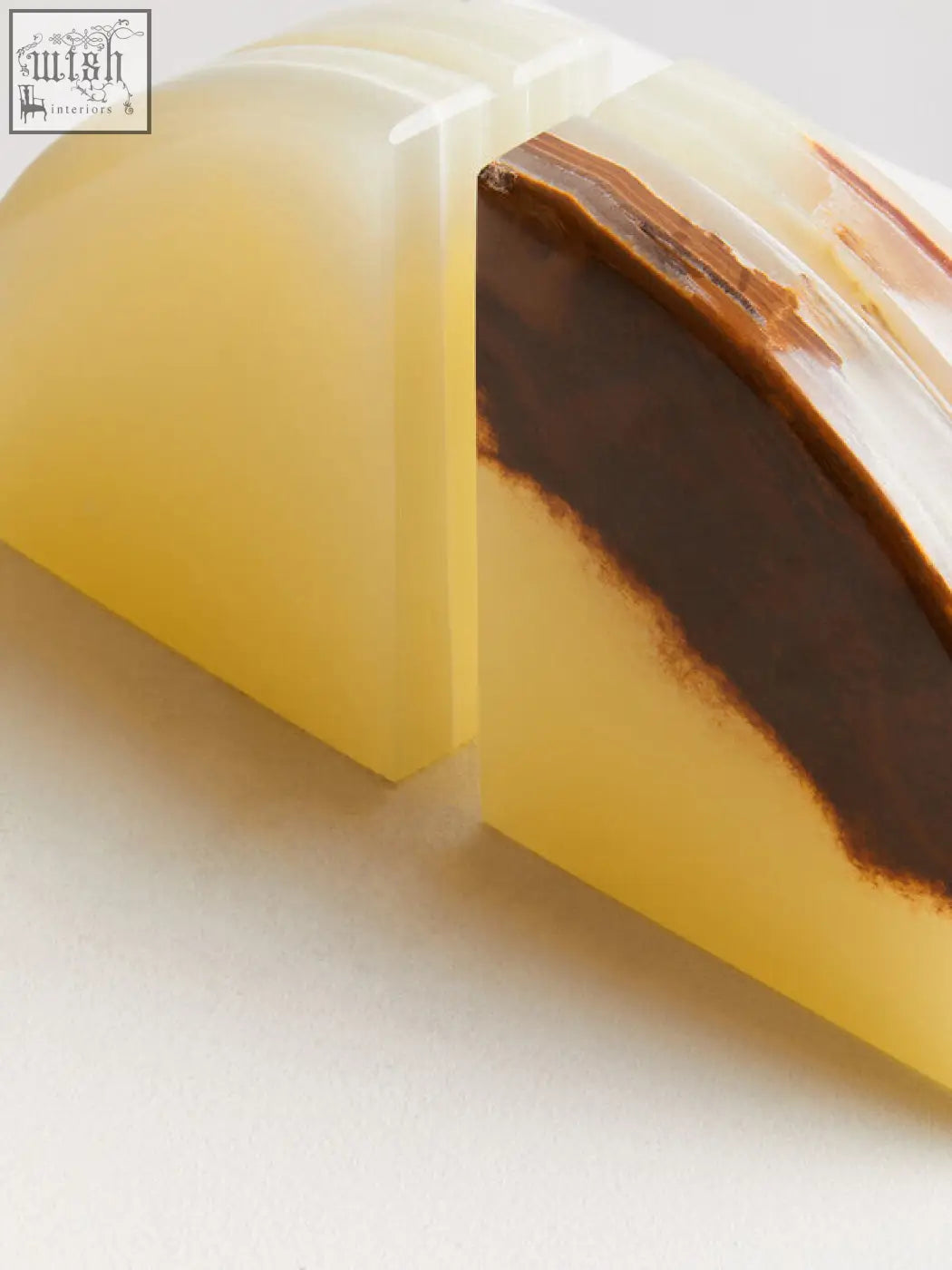 A pair of elegant semi-translucent two onyx bookends in warm yellow with rich brown veining oleena set