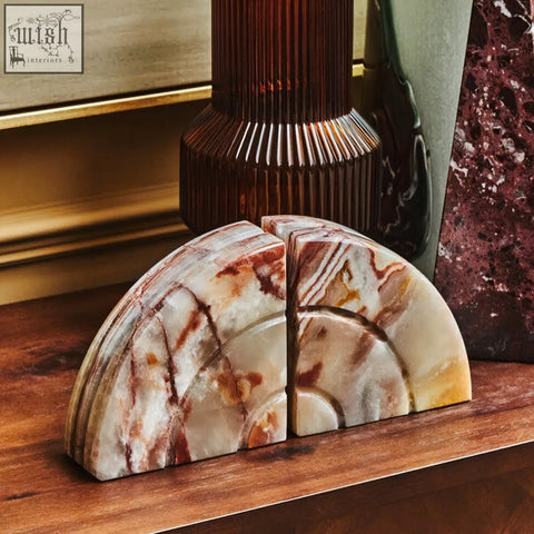 A pair of oleena set two onyx bookends with polished cream brown and amber swirls perfect for stylish shelving