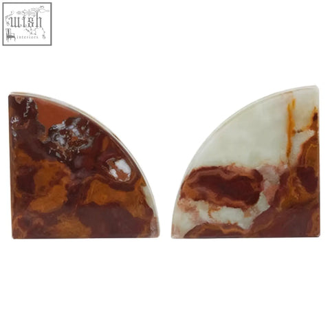Pair of semi-circular polished agate two onyx bookends with swirling brown and cream veining from oleena set