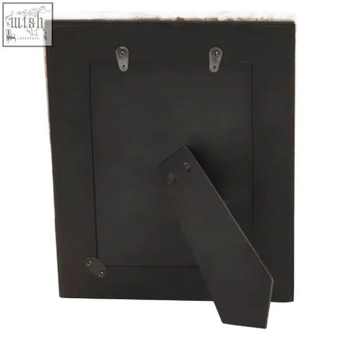 Black metal large photo frame with matte finish and silver hanging brackets shown from the back side