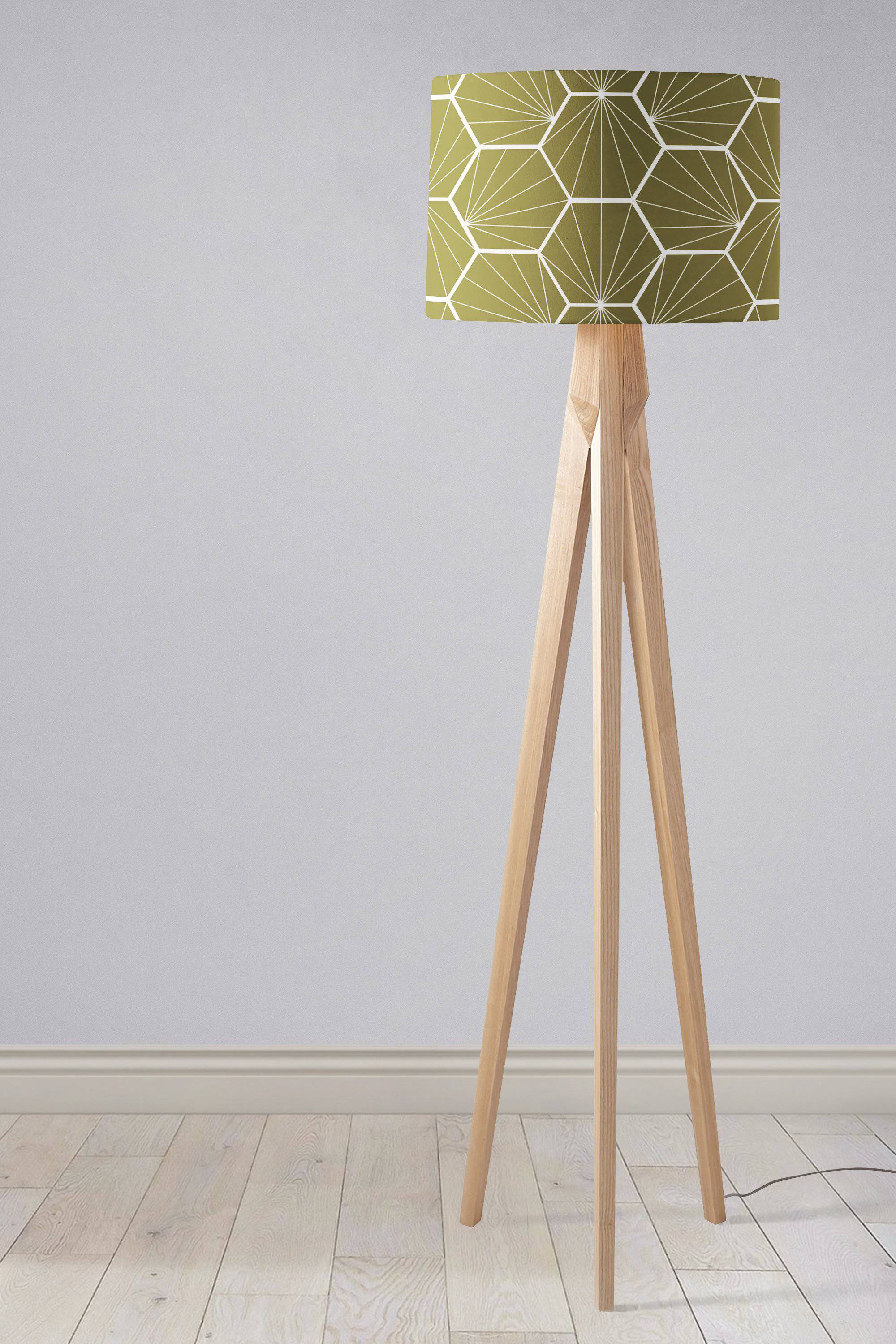 Olive green hexagon design lampshade on a minimalist wooden tripod floor stand perfect for table lamp use