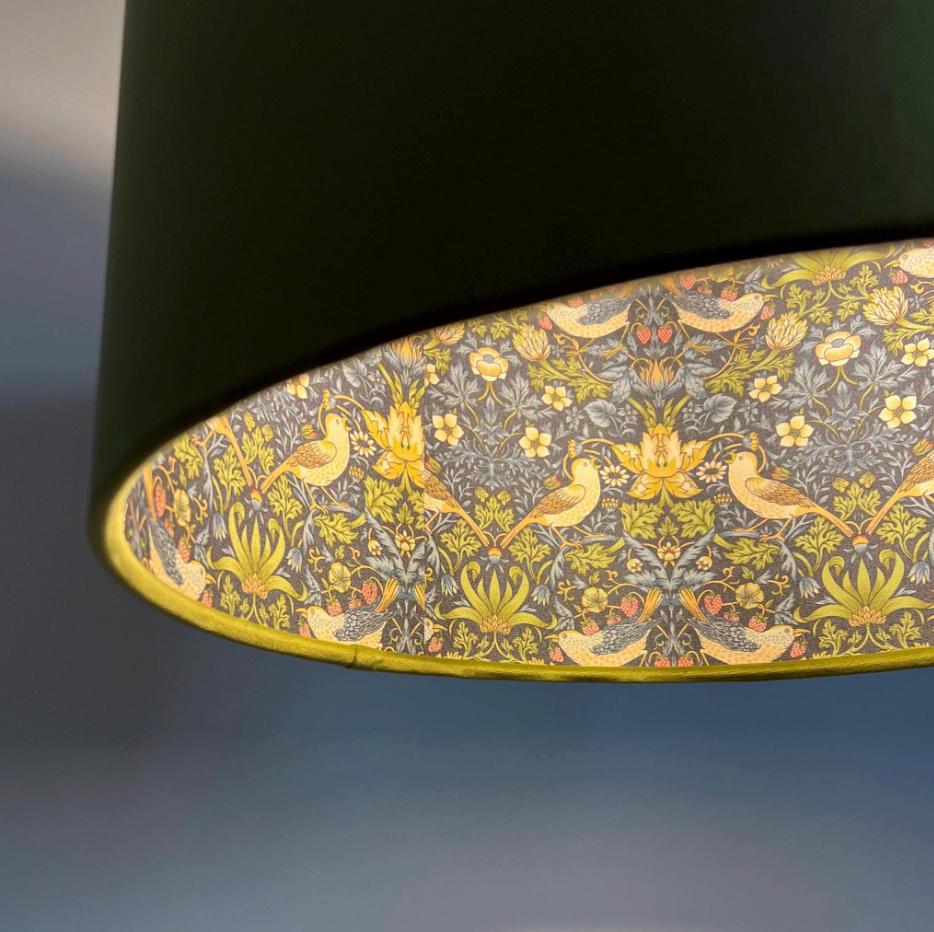Black cylindrical double sided ceiling light shade with olive green velvet and yellow bird floral pattern interior