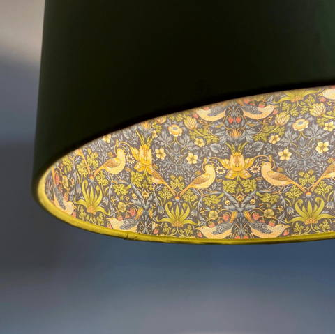 Black cylindrical double sided ceiling light shade with olive green velvet and yellow bird floral pattern interior