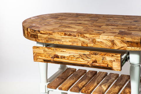 Olive wood butcher block counter island with warm grain pattern and white legs perfect as a table butcher block cart
