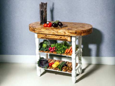 Rustic oval kitchen cart with white legs and shelves featuring an olive wood butcher block top and fresh produce storage