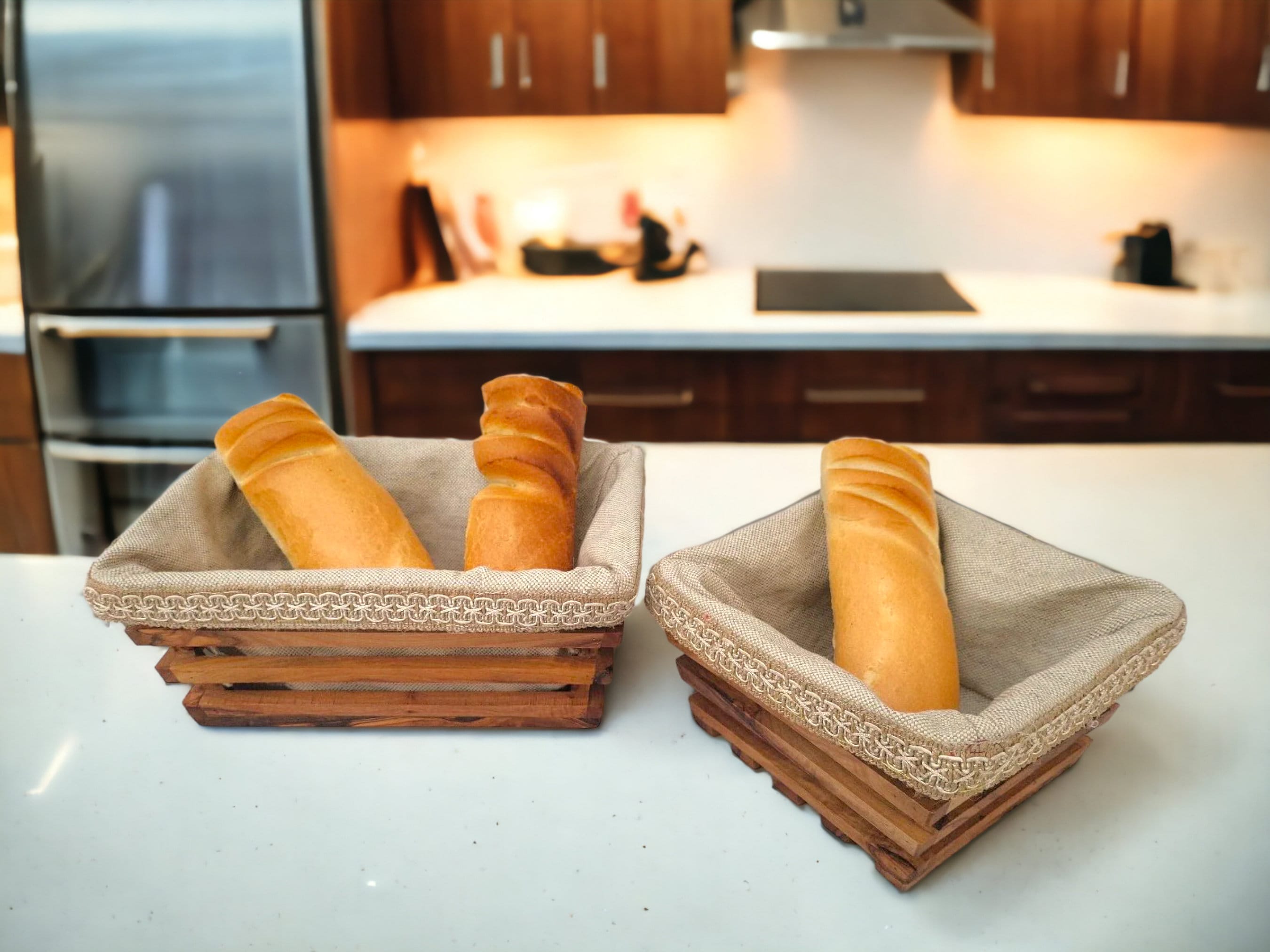 Two rustic olive wood bread baskets lined with beige linen and lace trimming perfect for serving bread