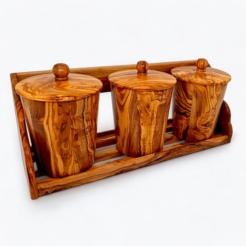 Set of three olive wood canisters with natural grain, rounded wooden knobs, perfect for kitchen spice storage