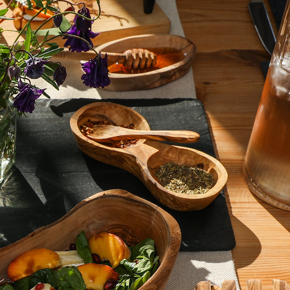 Handcrafted olive wood sugar jam mustard spoon with natural rustic finish and two compartments holding dried herbs