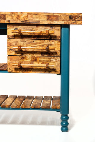 Teal kitchen cart with olive wood table butcher block top and drawers featuring natural grain and rustic handles