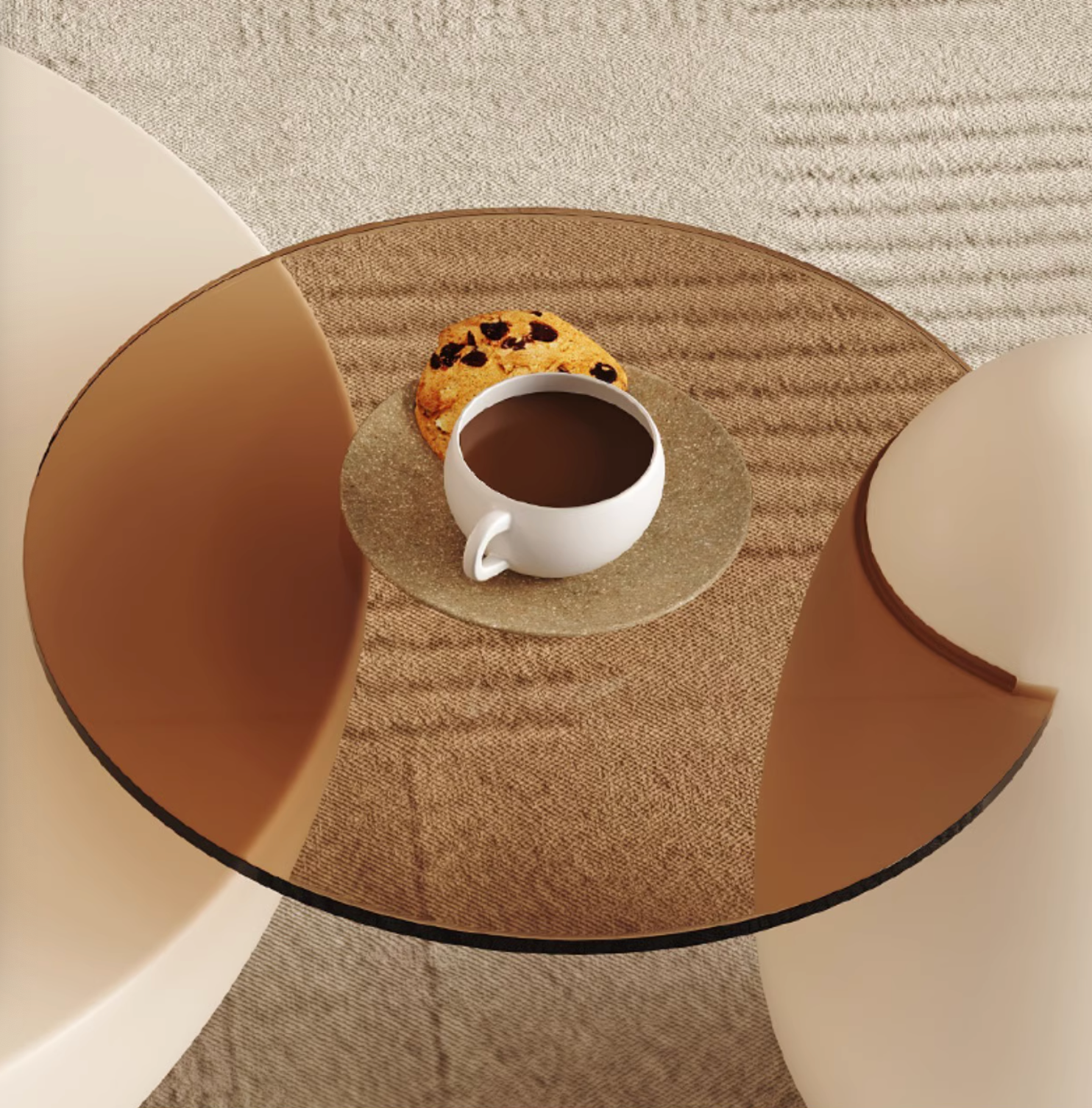 White ceramic mug of coffee on a textured gold coaster next to cookie on the oliver nesting coffee table white