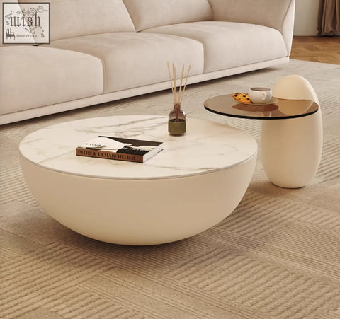 Cream-colored nesting coffee table with white marble top and smooth rounded edges perfect for stylish living spaces