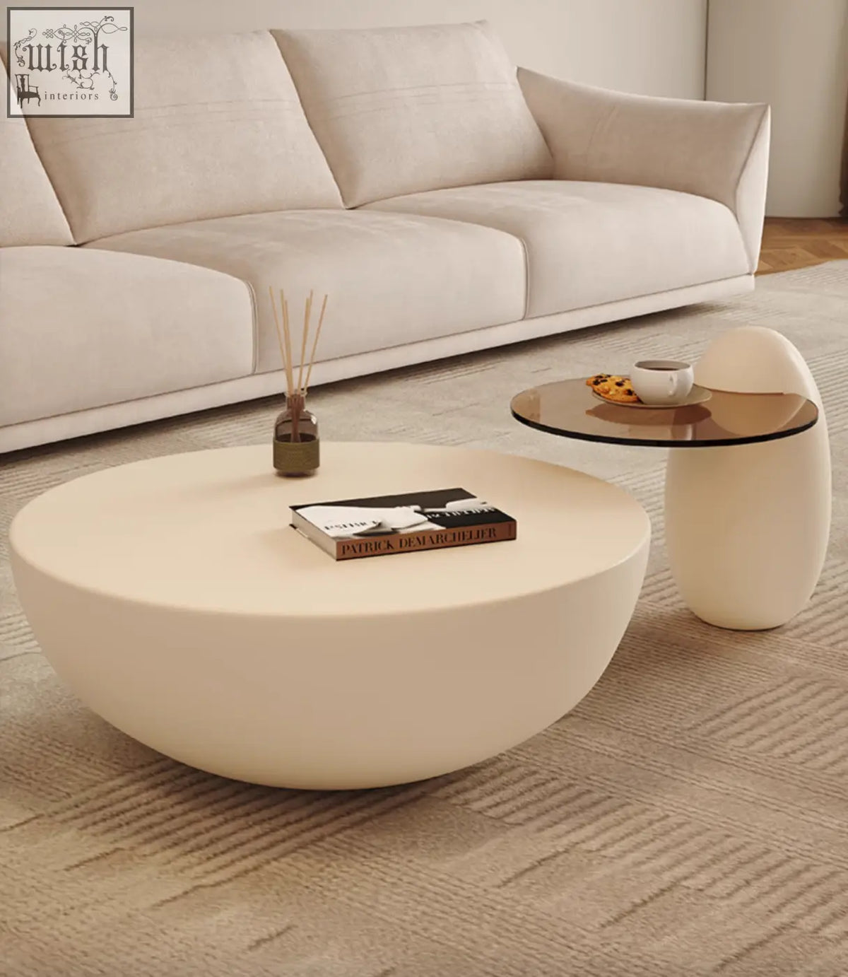 Cream-colored smooth oval nesting coffee table with minimalist design perfect for modern living spaces