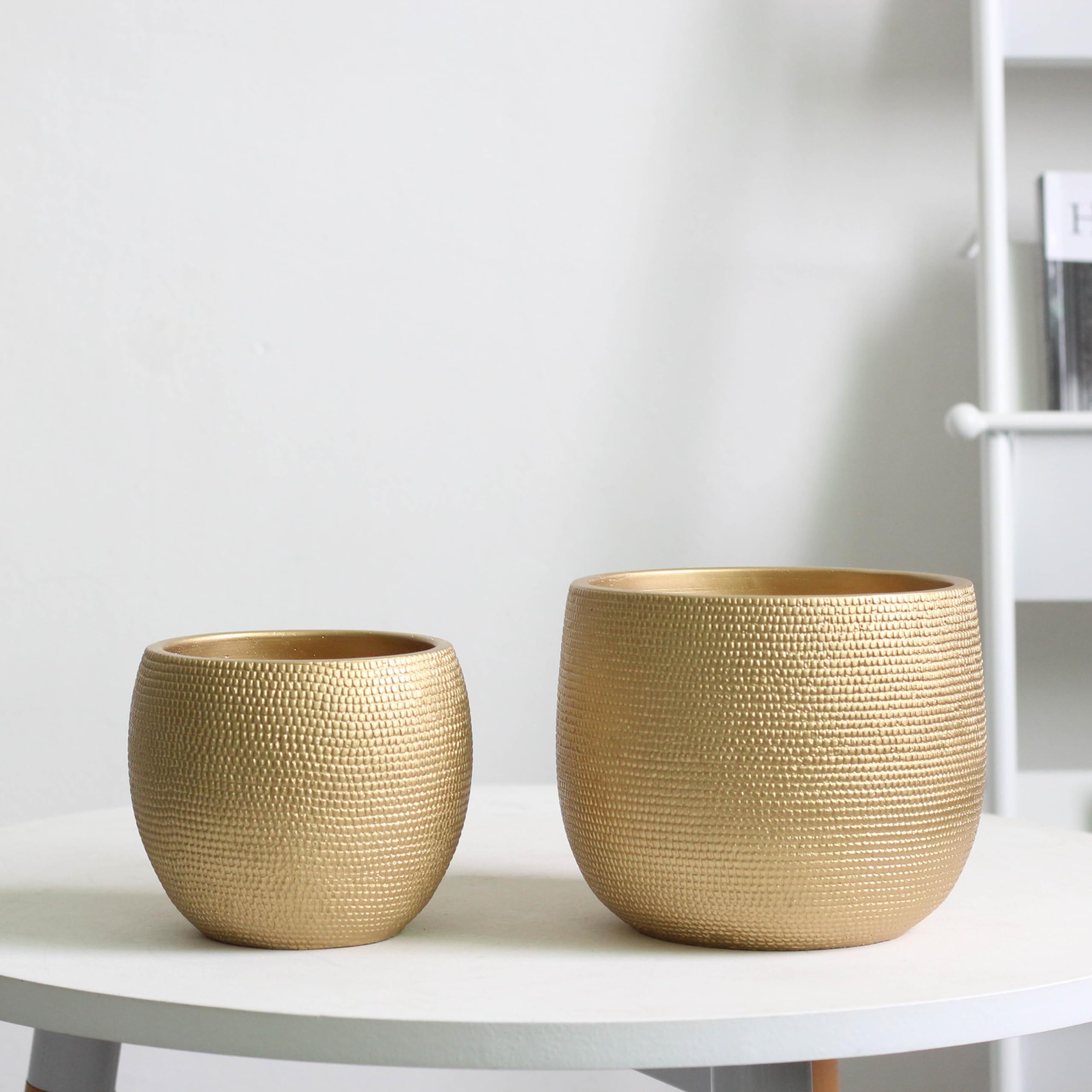 Two gold ceramic plant pots with a textured woven pattern from olly and rose for indoor and outdoor use