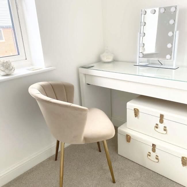 Beige velvet chair with gold-tone legs next to white olsen hollywood mirror 47x37cm perfect for glam decor