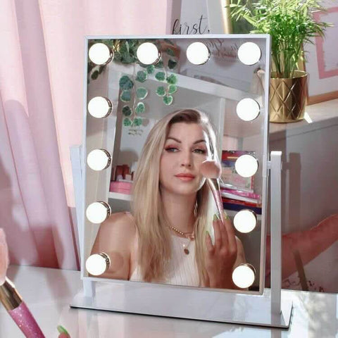 A sleek silver-framed hollywood mirror 47x37cm with round led lights perfect for stylish makeup and grooming