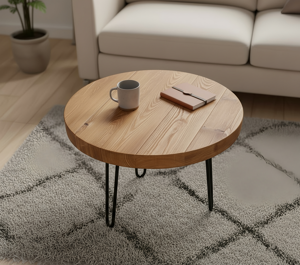 Olva round chunky coffee table with a round wooden top and black hairpin legs pictured table