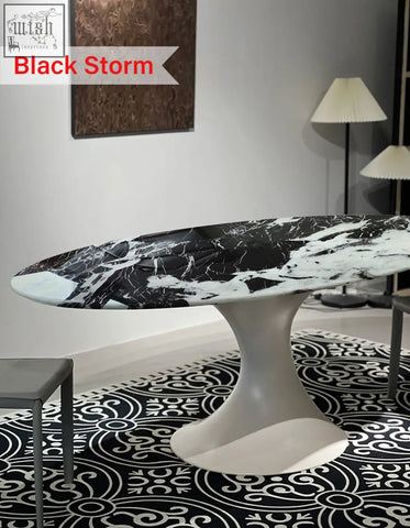 Omer oval dining table with black and white marble top and modern pedestal base perfect for any dining room