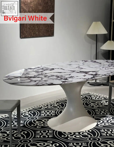 Bvlgari omer oval dining table with white marble top featuring black veining and a sleek white sculpted base for dining room