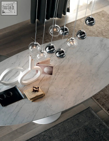Modern oval marble dining table omer with white pedestal base perfect for stylish dining room oval dining setups