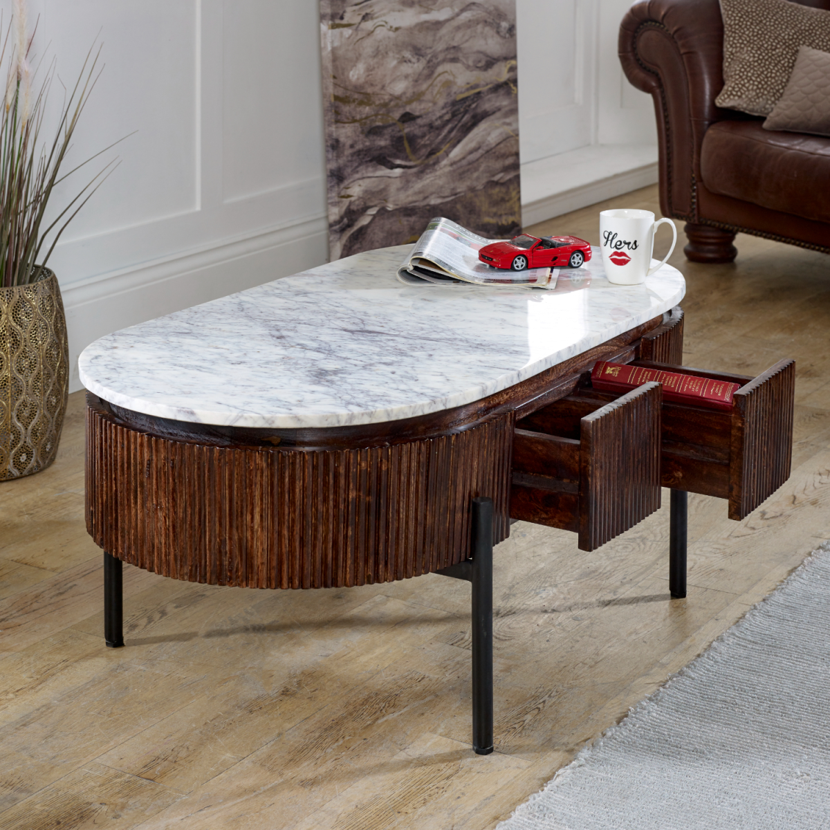 Elegant mango wood rectangular coffee table with white marble top, vertical wood slats, and black metal legs