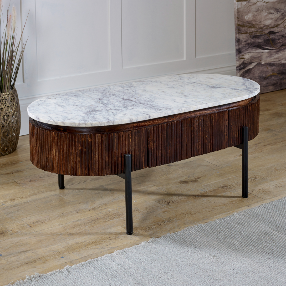 Elegant mango wood rectangular coffee table with white marble top dark wood slatted base and black metal legs