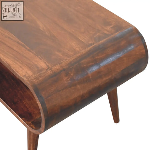 Curved california walnut coffee table with rich warm brown finish and sleek tapered legs perfect for living room