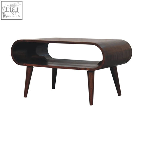 Mid-century modern california walnut coffee table with a sleek curved dark wood frame and tapered legs for living room