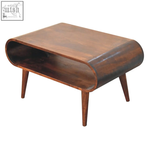 A sleek mid-century modern california walnut coffee table with a curved wooden top and tapered legs for the living room