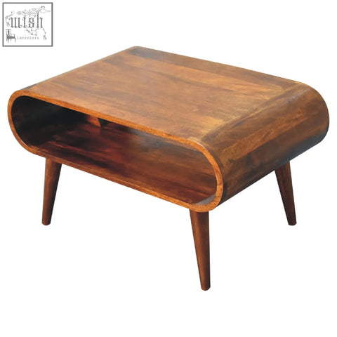 Open chestnut coffee table with curved rich brown mango wood top and tapered legs in chestnut finish
