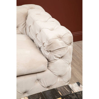 Cream-colored tufted leather sofa with classic chesterfield design as ophelia 3 seat beige velvet sofa alternative