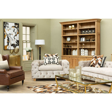 Light beige tufted armchair with geometric cushion paired with ophelia 3 seat beige velvet sofa for cozy seating