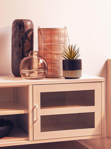 A sleek ceramic optik bottle vase with a dark brown base and swirling black patterns for stylish decor